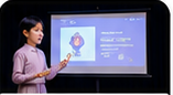 Student presenting on stage
